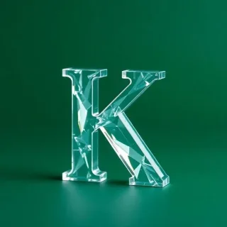 White glass — letter K